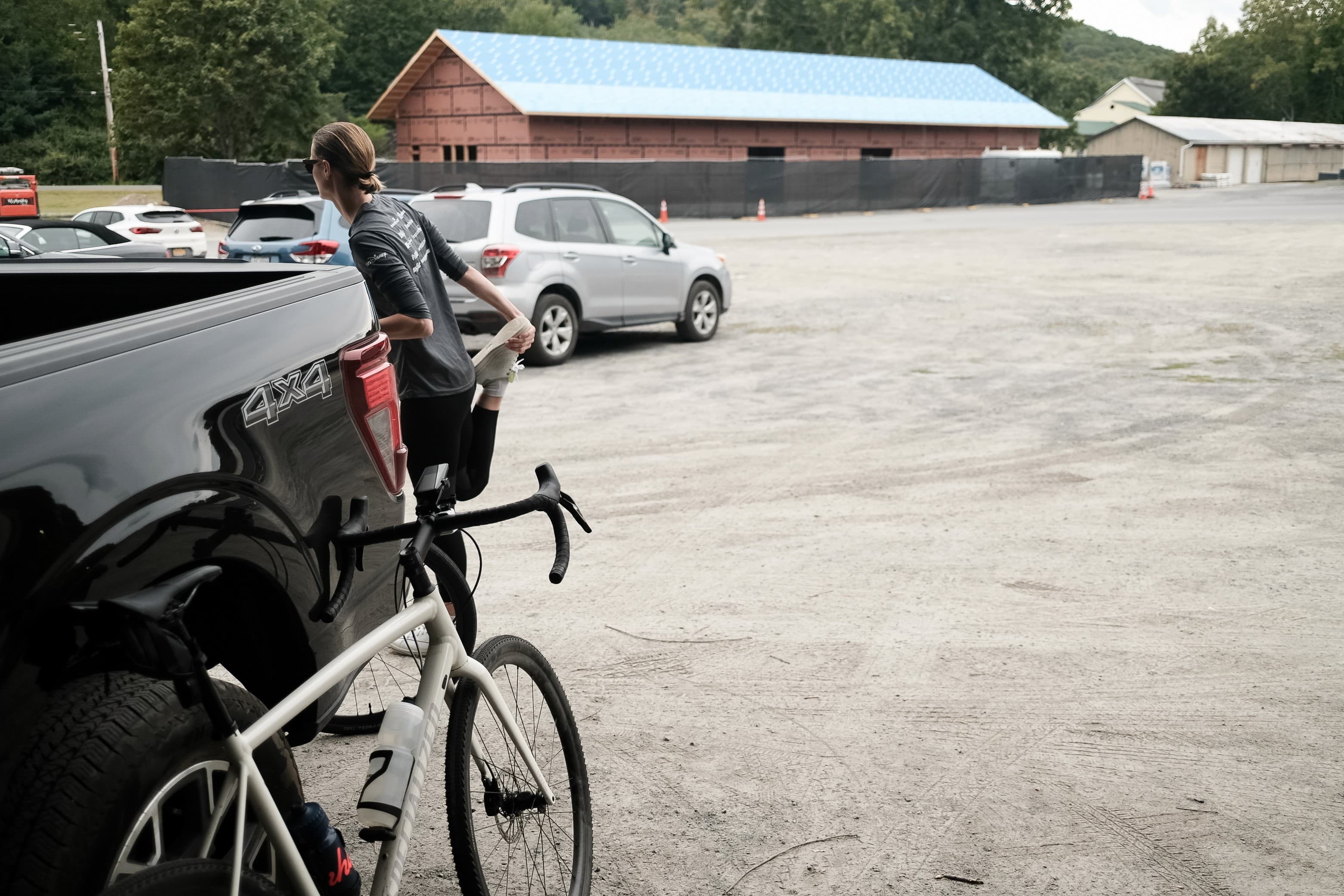 Amanda leaning on the truck after a bike ride in the Hudson Valley